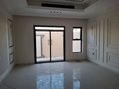 A luxurious villa including electricity, water, and central air conditioning, located directly opposite a mosque and on a main street, with modern des