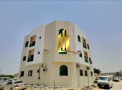Corner building for sale in Al Musalla, Sharjah.