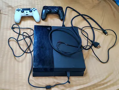 PS4 Console, 2 Controllers and games