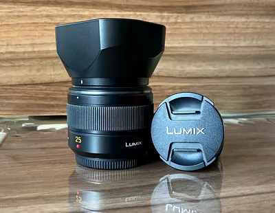 Panasonic Lumix 25mm f/1.7 Lens with Hood and Cap - Good Condition