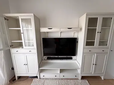 White wooden entertainment center with cabinets and TV shelf from IKEA (TV and speaker not included)