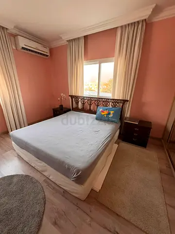 Wooden Bed with Carved Headboard and Mattress