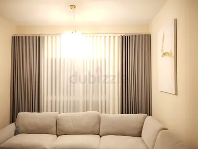 Light grey floor-to-ceiling curtains with sheer inner panels - customize
