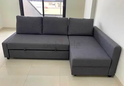 Grey L-Shaped Sofa Bed with Pull-Out Section