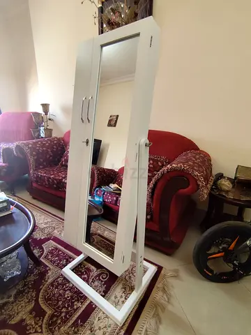 Free-standing white mirrored jewelry cabinet with storage