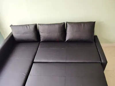 Black faux leather sofa bed - good condition