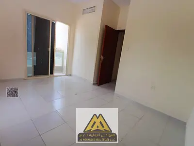 1BR in Al Rashidiya 2, balcony, central AC, near Falcon Towers, AED 25,997, 4/6 cheques.