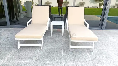 Pair of white outdoor sun loungers with side table - good condition