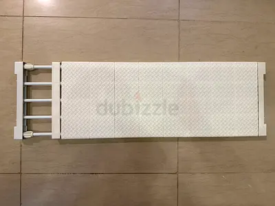 Extendable plastic shelf