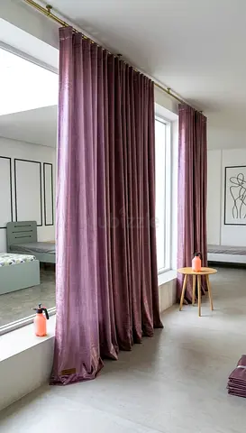 Pair of mauve/full-length velvet blackout curtains with curtain rod