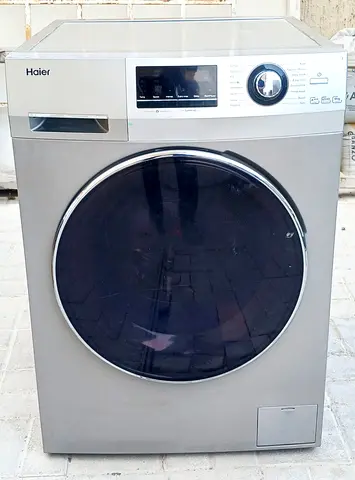 Front load Haier 8kg washing machine, grey color, it is working good condition.