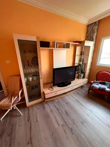 Modern TV Unit with Storage Cabinets and Shelves