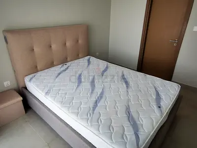 Beige upholstered queen size bed with mattress  - perfect condition