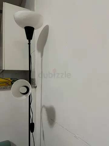 Black metal floor lamp with dual adjustable lights - good working condition