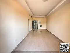 Two bedrooms and a living room with a balcony in Al Jurf 3