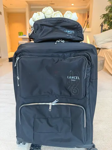 Lancel luggage + toiletry bag (from boutique with receipt)