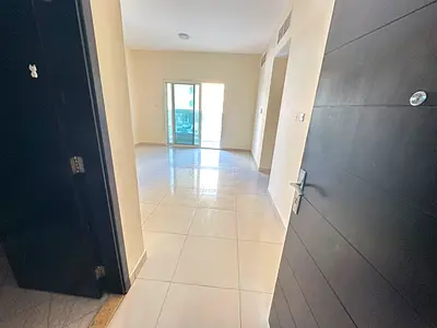 Two rooms and a hall, 2 bathrooms, balcony, built-in wardrobes, opposite Al Hikma School, close to