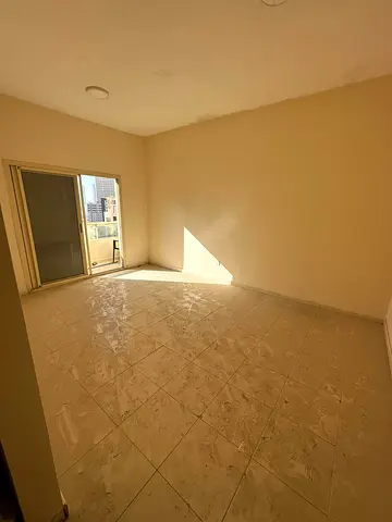 Al Taawun, Dubai Exit: 2 bedrooms, living room, and balcony with an open view + parking. Central A/C. Payment via 4 cheques; security deposit by chequ