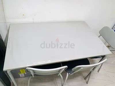 White rectangular dining table with 3 matching chairs - good condition