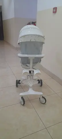 White baby walker with canopy and wheels - good condition