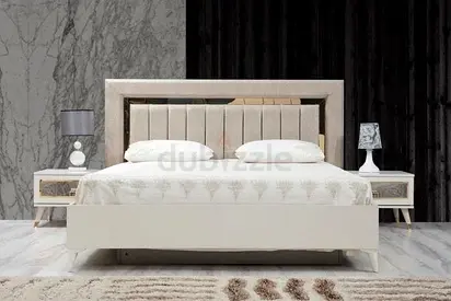 King-size modern upholstered bed with matching bedside tables