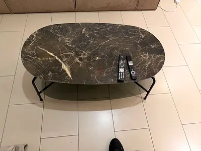 Oval marble-look coffee table with metal legs - perfect condition