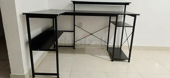 L-shaped black metal computer desk with shelves - good condition