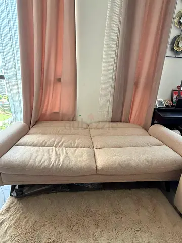 Beige fabric sofa bed / convertible couch - good condition