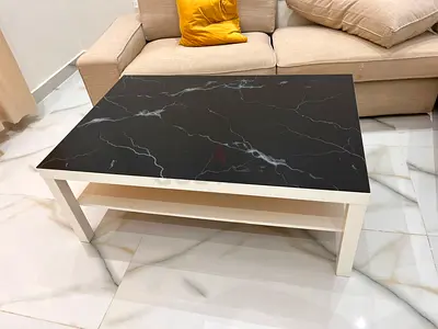 White Frame Coffee Table with Black Marble Top — Good Condition