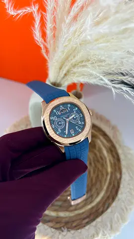 Patek Philippe men's rose gold-tone chronograph watch with blue rubber strap