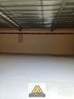 Large warehouse space without mezzanine in Al-Jarf Industrial Area, behind the Chinese Market, close
