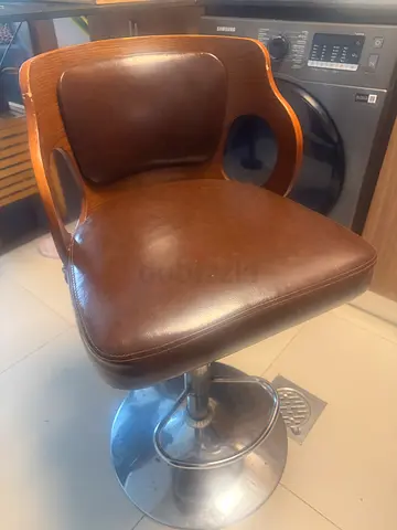 Wooden swivel bar stool with brown leather seat - good condition pickup only