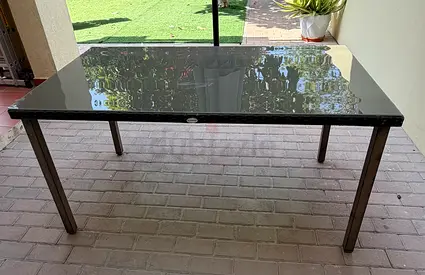 Outdoor table with tempered glass