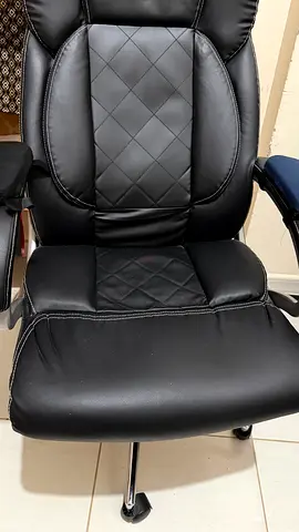 Black ergonomic office chair with padded armrests — good condition. No scratches or tears. Very good