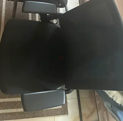 Black Mesh Office Chair with Adjustable Armrests - Good Condition