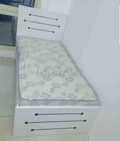 Single white bed with mattress — good condition