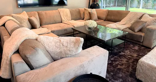 Large L-shaped beige sectional sofa - comfortable, good condition