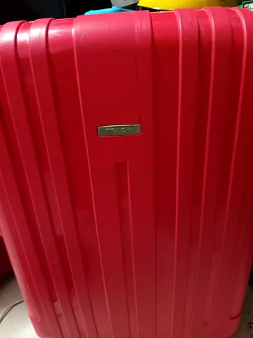Red hard-shell medium luggage suitcase - good condition