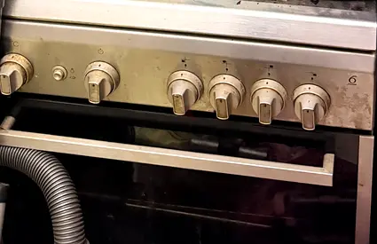 Used stainless steel gas oven with 4 burners and grill - fair condition