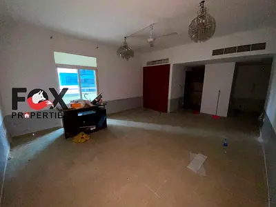 **Studio for annual rent in Al Rashidiya 1, Ajman: free parking, balcony, built-in wardrobes, near the Free Zone.**