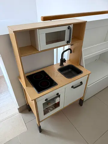 IKEA toy kitchen with extra plastic fruits & vegetables.