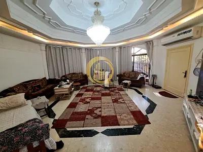 House for sale in Al-Jazat, corner on two paved streets, area 6,300 sq ft. Two regular electricity meters. Composed of: Main section: Living roo