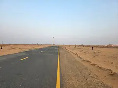 For sale in Al Qasimia City, Phase 4: Industrial land plots, second plot from the main road.