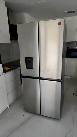 Stainless Steel 4-Door Side-by-Side Refrigerator with Water Dispenser - Good Condition