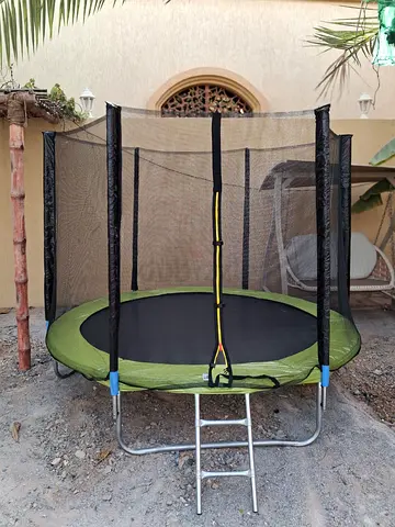 Used 6ft Round Trampoline with Safety Net and Ladder - Good Condition