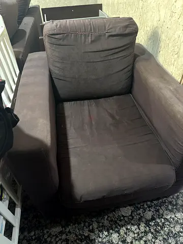 Dark brown single-seater sofa / armchair in good used condition