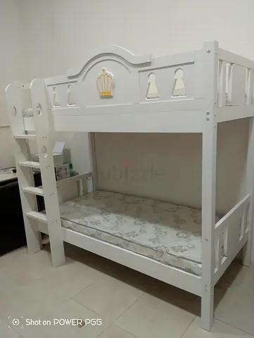 White wooden kids bunk bed with ladder and mattress, good condition