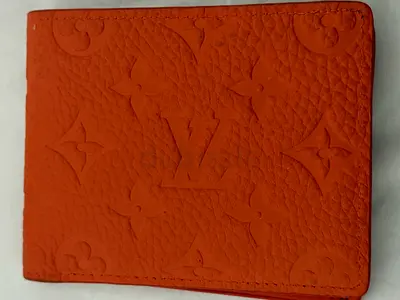 Louis Vuitton embossed monogram leather bi-fold wallet - orange