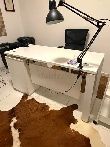 White modern office desk with storage cabinets and desk chair - good condition