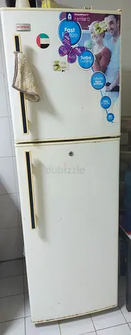White double-door refrigerator - Not cooling